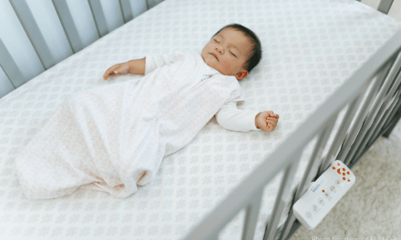 helping newborn sleep in bassinet