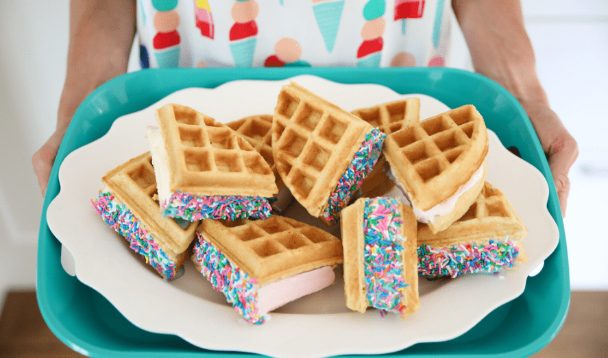 Waffle Ice Cream Sandwiches with sprinkles on a platter