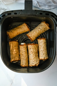 overhead shot of turkey and cheese roll-ups in air fryer