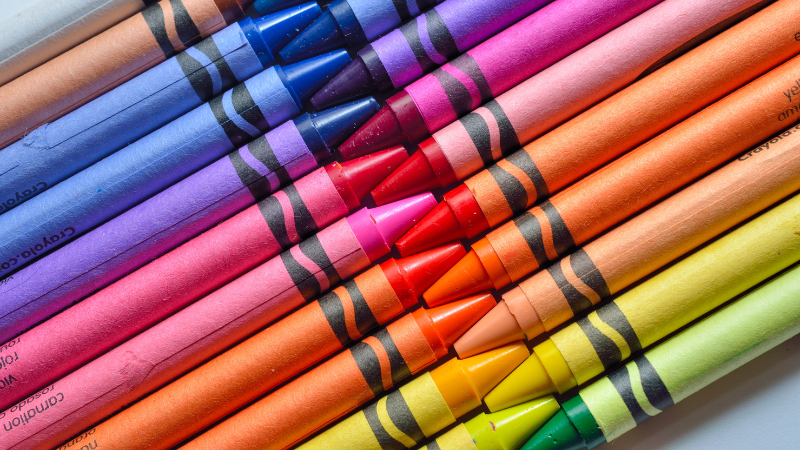 close-up of crayons in a rainbow of colors
